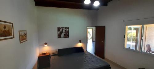 Postel nebo postele na pokoji v ubytování Casa Nano