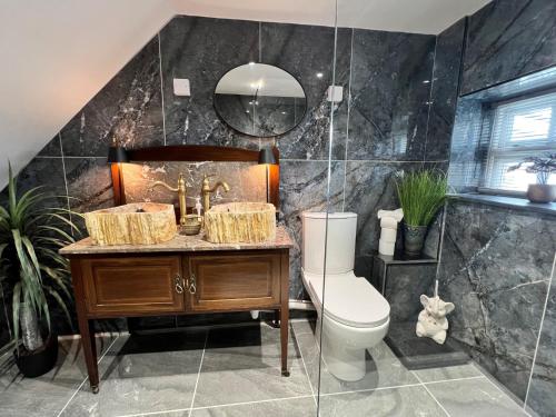 a bathroom with a toilet and a sink at 2 Bed in Kielder 88214 in Yarrow