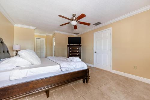 a bedroom with a bed and a ceiling fan at Renovated 3BR Dog Friendly Pond View WD in Whitfield