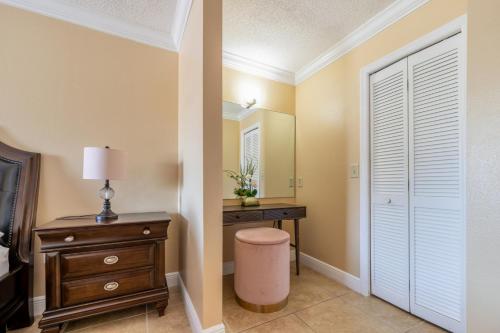 a bedroom with a dresser and a mirror at Renovated 3BR Dog Friendly Pond View WD in Whitfield