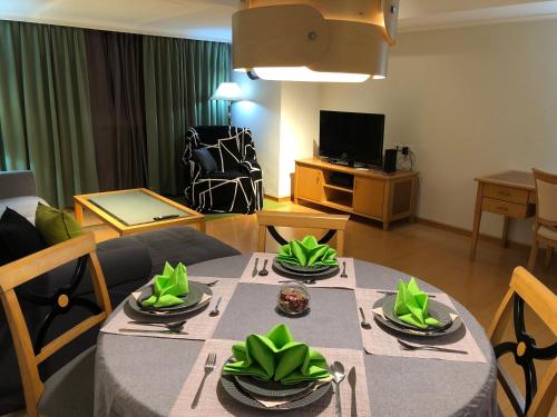 a living room with a dining table and a living room at Large family room near Metro Taipei station for comfort and convenience, where 5 can relax and create unforgettable moments in Taipei