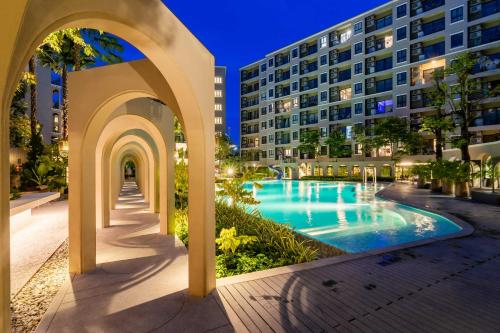 a view of a building with a swimming pool at Hua Hin La Casita Beautiful Two Bedroom Condo With Great Views in Hua Hin
