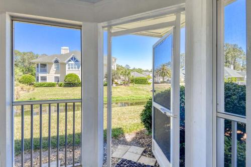 a view from the front porch of a home with sliding glass doors at Luxury 4-BR-BBQ-waterview-screened lanai-wood floors 211 in Saint Augustine