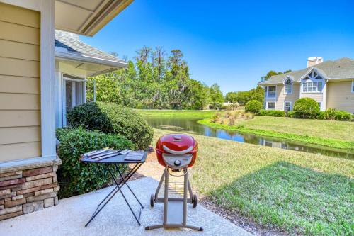 a barbecue grill with a helmet on it in front of a house at Luxury 4-BR-BBQ-waterview-screened lanai-wood floors 211 in Saint Augustine