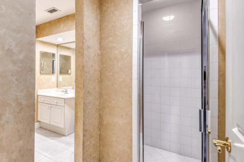 a bathroom with a shower and a sink at Luxury 4-BR-BBQ-waterview-screened lanai-wood floors 211 in Saint Augustine