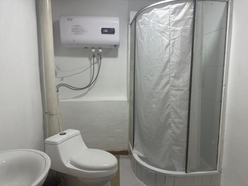 a bathroom with a shower and a toilet and a sink at Gana's Guest House and Tours in Ulaanbaatar