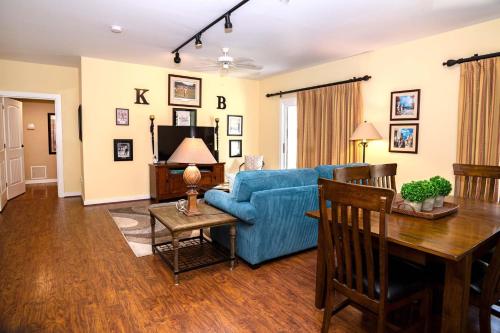 a living room with a blue couch and a table at 2 BR Secluded patio with courtyard 5107P2 in Saint Augustine