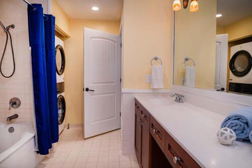 a bathroom with a tub and a sink and a shower at 2 BR Secluded patio with courtyard 5107P2 in Saint Augustine