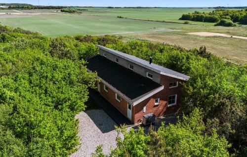 an overhead view of a brick building in a field at Cozy Home In Ringkøbing With Sauna in Ringkøbing
