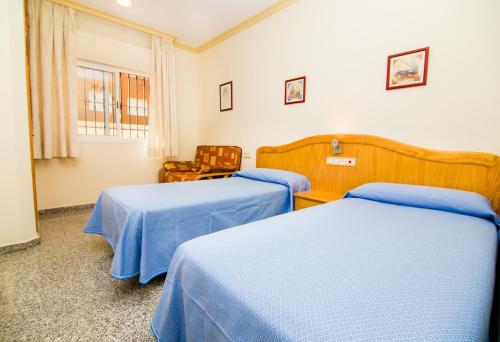 Lova arba lovos apgyvendinimo įstaigoje Hostal Los Corchos