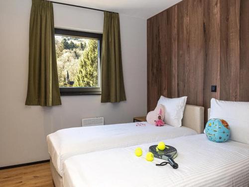 a room with two beds with toys on them at Villa in Belgium with Private Terrace in La Roche-en-Ardenne