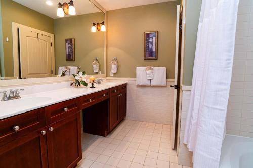 a bathroom with a sink and a shower at 5324-1P Great balcony view of courtyard with pool in Saint Augustine