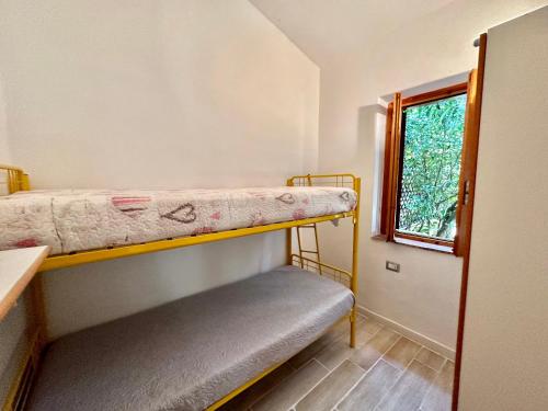 Postel nebo postele na pokoji v ubytování Appartamento a 650 mt dal mare - San Teodoro
