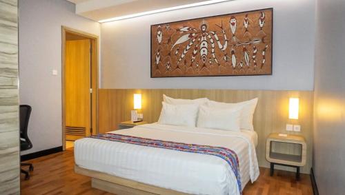 Postel nebo postele na pokoji v ubytování Best Western Sagita Hotel Jayapura