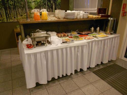 a table with a buffet of food on it at Standard Delegacyjny Bed & Breakfast in Dąbrowa Górnicza