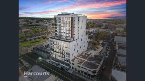 an aerial view of a tall white building at Executive Rental - Campbelltown in Campbelltown