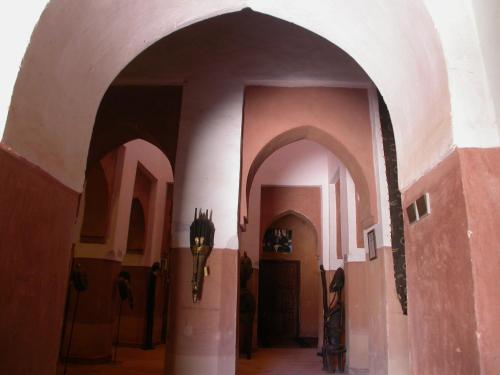 an archway in a building witharmor at Hotel Tomboctou in Tinerhir