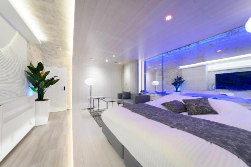 Ένα ή περισσότερα κρεβάτια σε δωμάτιο στο Hotel Aqua Vitae (Adult Only)