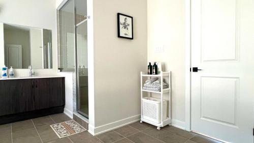 a bathroom with a sink and a mirror at Entire Home in Lake of Bays -Huntsville Muskoka Algonquin in Dwight