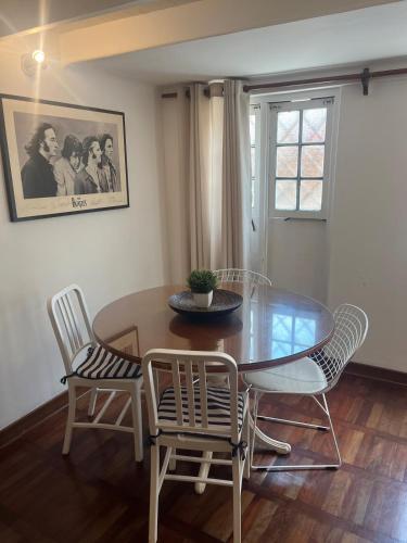 a dining room with a glass table and chairs at Casita de Ocharan Miraflores a dos calles de Larcomar in Lima