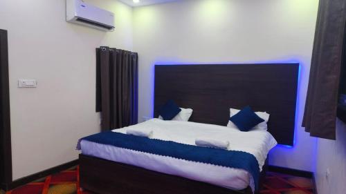Ένα ή περισσότερα κρεβάτια σε δωμάτιο στο Sana Guest House