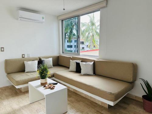 Un lugar para sentarse en Modern apartment in the Ixtapa hotel area