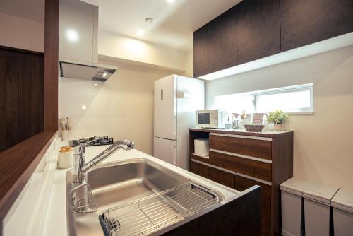 Η κουζίνα ή μικρή κουζίνα στο 無料レンタカー付 Value Residence Hotel 腰原