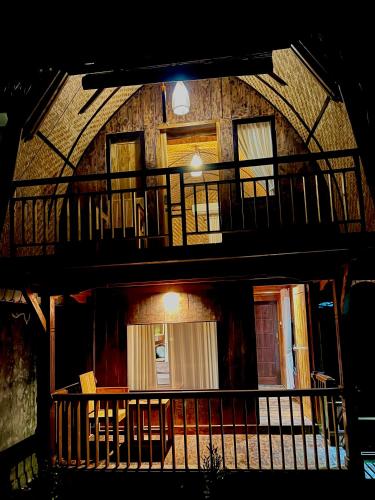 a building with balconies on the side of it at Nona Lodge in Tetebatu