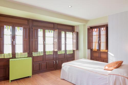 Ένα ή περισσότερα κρεβάτια σε δωμάτιο στο Apartamentos Santana