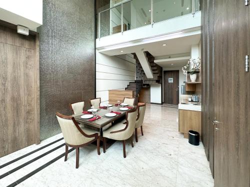 a dining room with a table and chairs at Holiday Inn Cikarang Jababeka by IHG in Cikarang