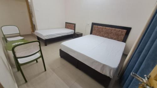 Ένα ή περισσότερα κρεβάτια σε δωμάτιο στο Pragya homestay