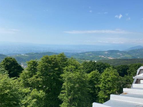 a view of trees from the top of a building at Mansarda Le Laite by Ca-Sa Check in Conco