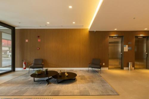 Apartamento novo em frente ao Allianz Parque com 1 vagaにあるシーティングエリア