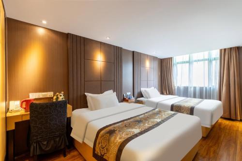 Postel nebo postele na pokoji v ubytování XW Hotel