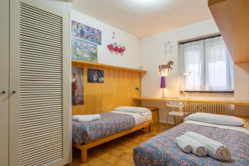 Postel nebo postele na pokoji v ubytování Il Giardino di Via Parrocchiale
