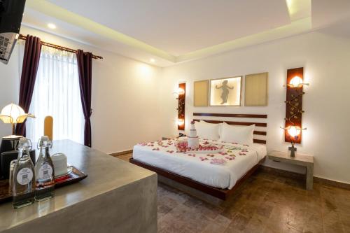 Ένα ή περισσότερα κρεβάτια σε δωμάτιο στο Angkor Breeze Hotel & Spa