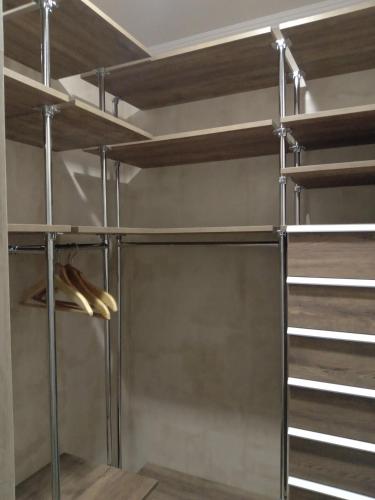 a walk in closet with metal bunk beds at Apart-hotel in Avalon on Chornovola St in Lviv