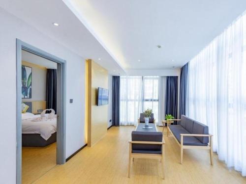 Ένα ή περισσότερα κρεβάτια σε δωμάτιο στο GreenTree Inn Express Fuzhou Minhou County Mindu Custom Park