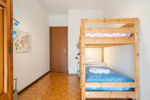 a bedroom with two bunk beds in a room at L'Abete - Introbio Apartment in Introbio