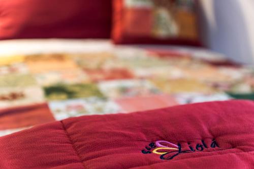 Postel nebo postele na pokoji v ubytování B&B Liolà