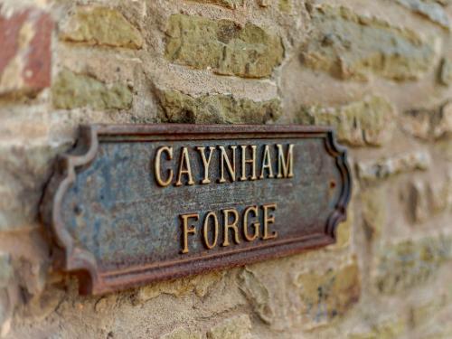 a sign on a brick wall with the name canyonian force at 2 Bed in Ludlow CHL38 in Caynham