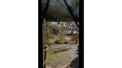 a view from the inside of a tent at Banyula Cove by Tiny Away in Barnes Bay