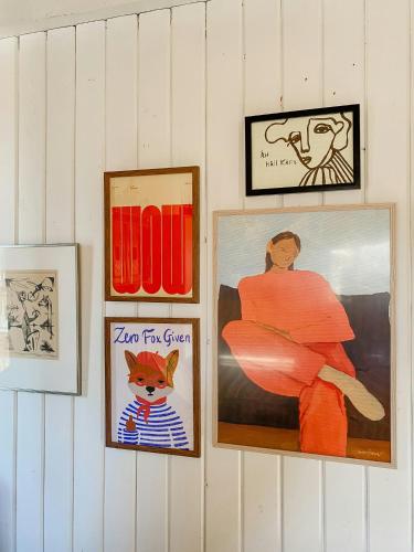 a group of pictures hanging on a wall at Spacious Farm By Åkulla Beech Forests in Tvååker
