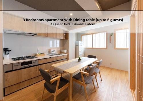a kitchen and dining room with a table and chairs at Shirakabanoyado - EBISU, 白樺の宿 - 惠美须, SELF CHECK IN in Osaka