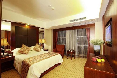 Giường trong phòng chung tại Hangzhou Merchant Marco Garden Hotel