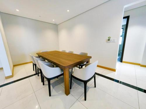 a conference room with a wooden table and chairs at Awesome Hotel in San Juan
