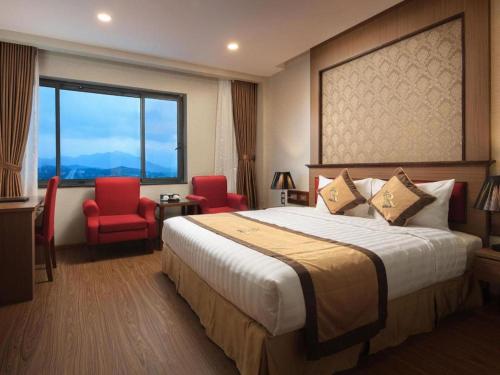 Katil atau katil-katil dalam bilik di Royal Palace Hotel