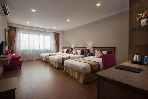 Katil atau katil-katil dalam bilik di Royal Palace Hotel