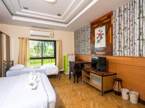 Postel nebo postele na pokoji v ubytování Prew Lom Chom Nam Resort