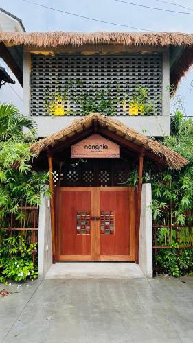 a door to a house with a sign on it at Private 4 bedrooom Nongnia Beach Villas in Tân Thành (1)
